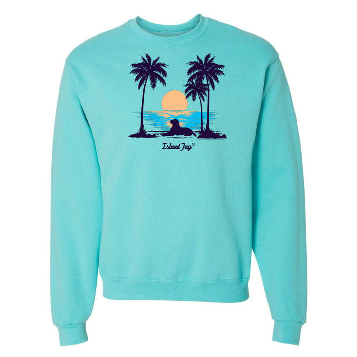Light blue sweatshirt with a tropical graphic of palm trees and a sunset on a white background