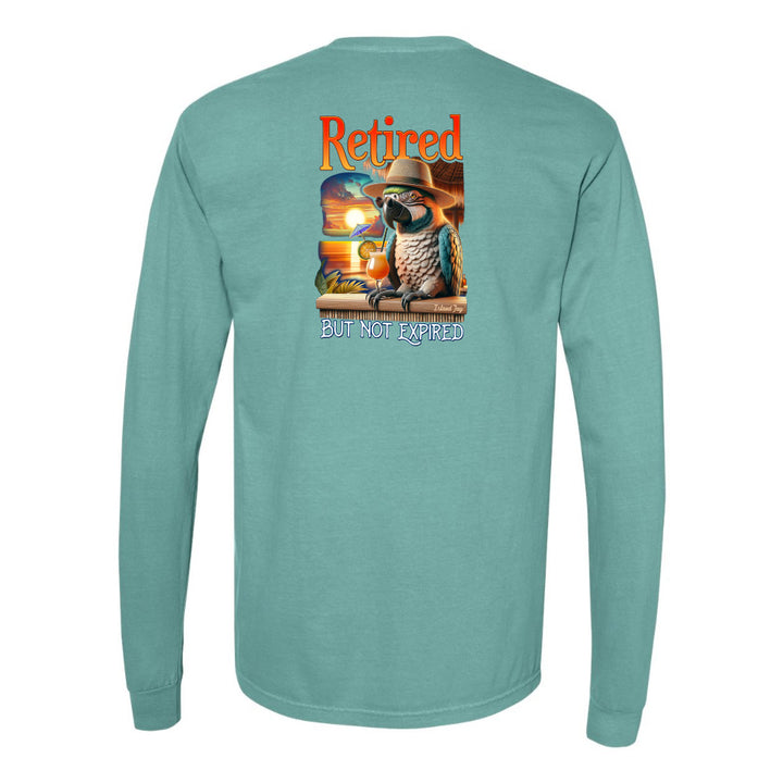 Teal long-sleeve shirt with a parrot graphic and 'Retired but not expired' text on the back.