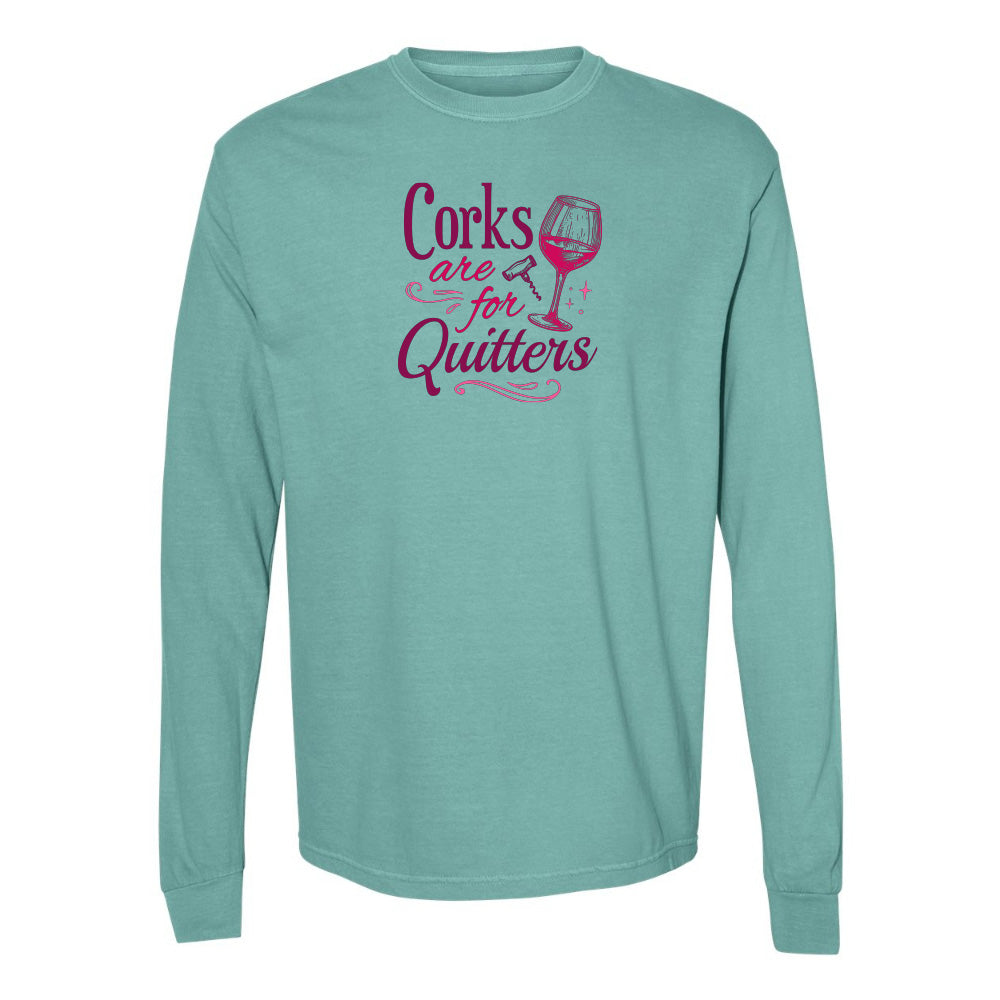 Teal long-sleeve shirt with pink text and wine glass graphic on a white background