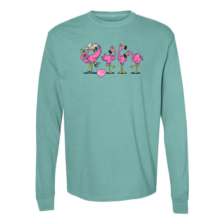 Teal long-sleeve shirt with pink flamingo design on a white background