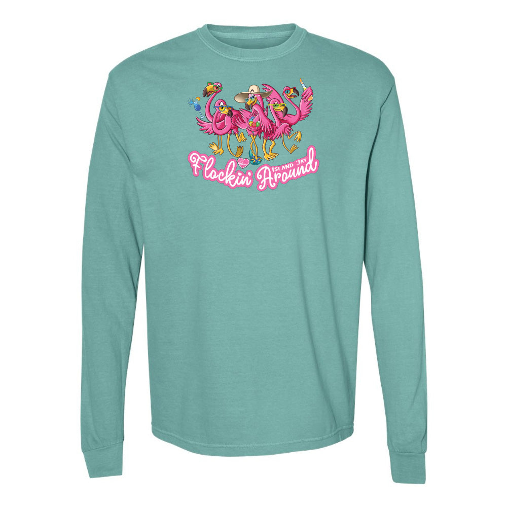 Teal long-sleeve shirt with pink flamingo design and text on a white background