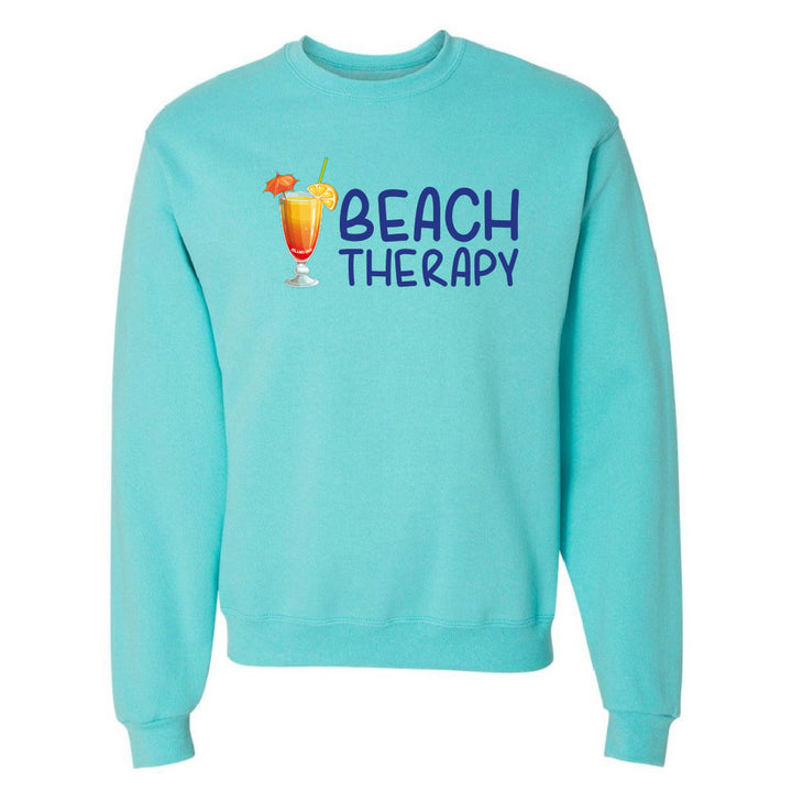 Turquoise sweatshirt with 'Beach Therapy' text and cocktail graphic on a white background