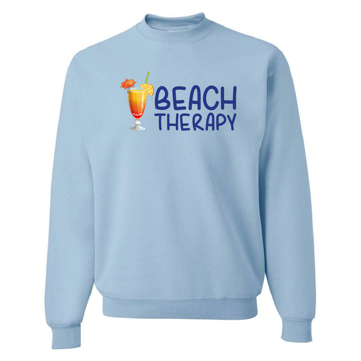 Light blue sweatshirt with 'Beach Therapy' text and cocktail graphic on a white background
