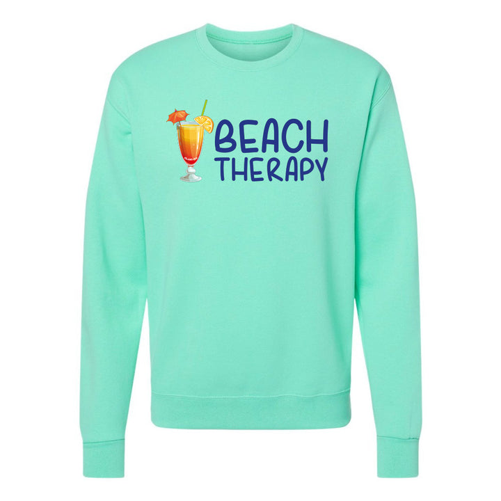 Mint green sweatshirt with 'Beach Therapy' text and cocktail graphic on a white background