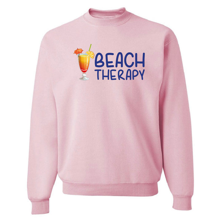 Pink sweatshirt with 'Beach Therapy' text and cocktail graphic on a white background