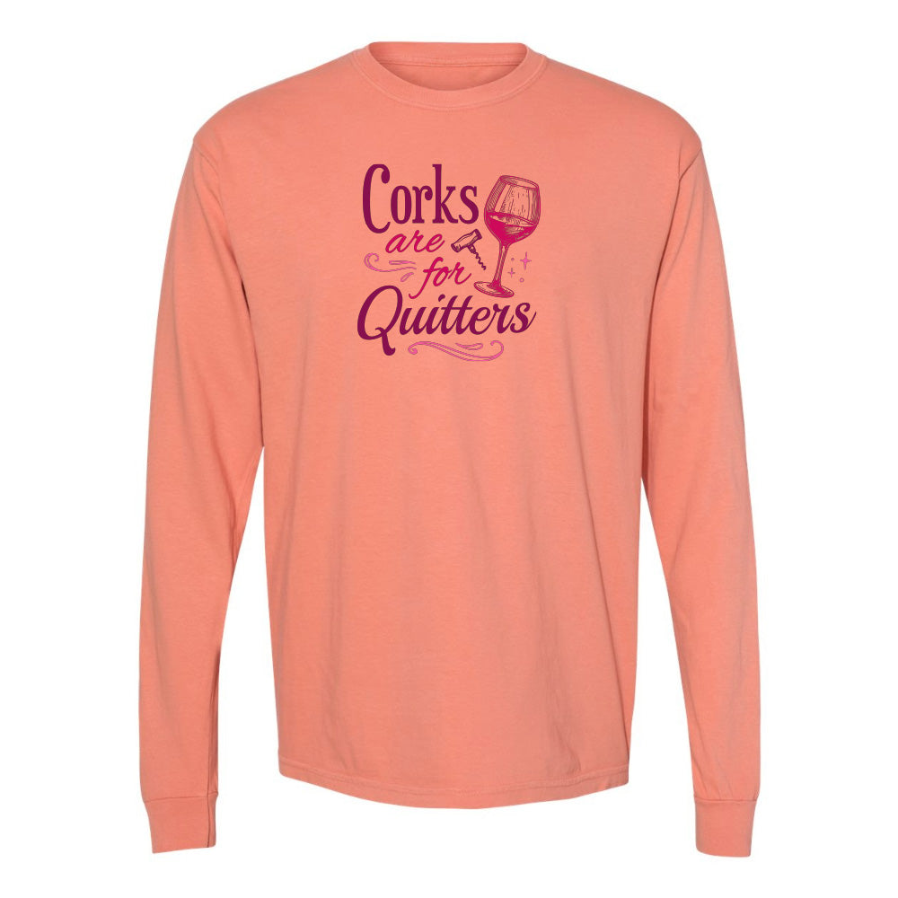 Coral long-sleeve shirt with purple text and wine glass graphic on a white background