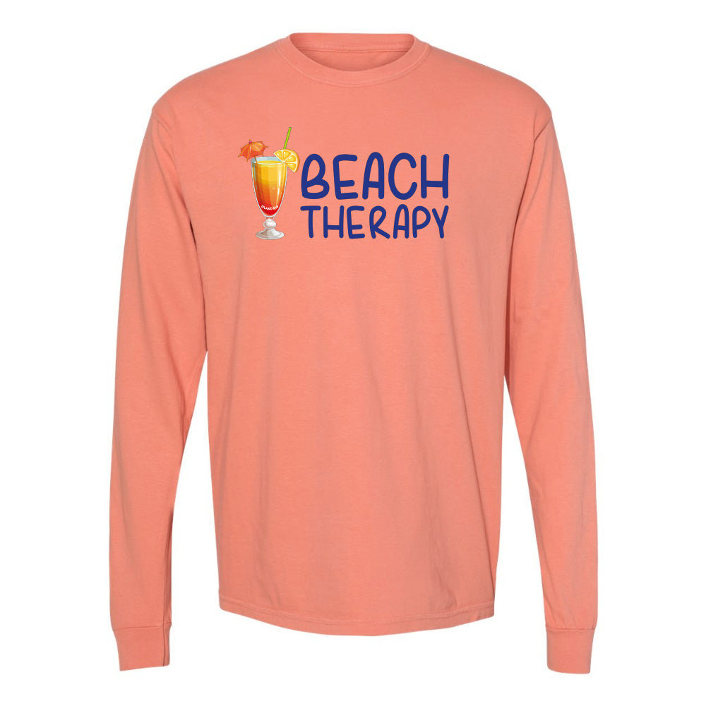 Coral long-sleeve shirt with 'Beach Therapy' text and cocktail graphic on a white background