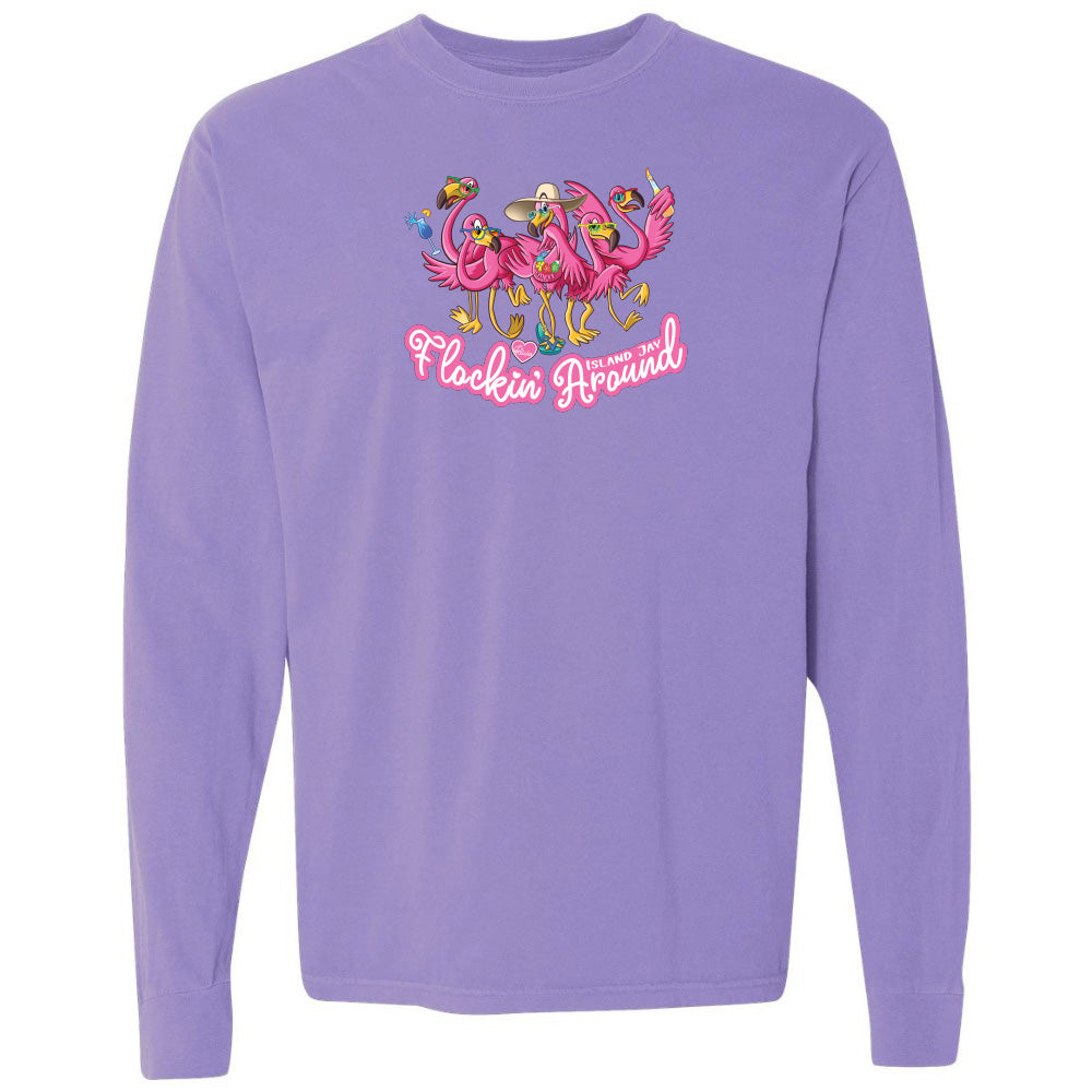 Purple long-sleeve shirt with flamingo design and text on a white background