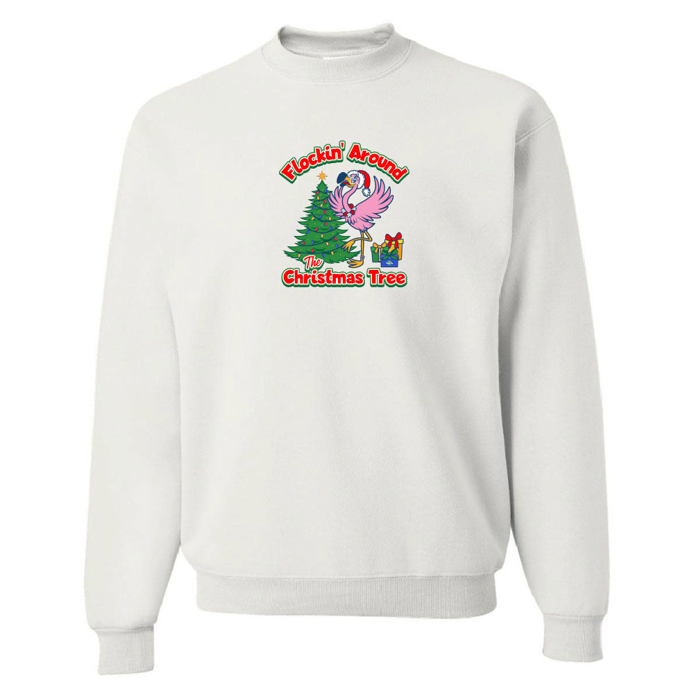 White sweatshirt with a festive design featuring a flamingo and Christmas tree on a white background