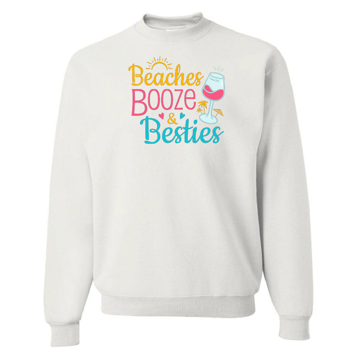 White sweatshirt with 'Beaches Booze & Besties' text and graphics on a white background