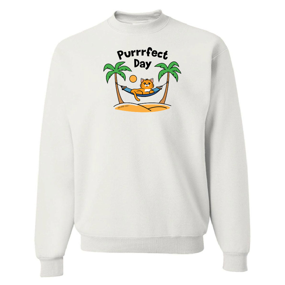 White sweatshirt with a 'Purrfect Day' graphic featuring a cat, palm trees, and a hammock on a white background.