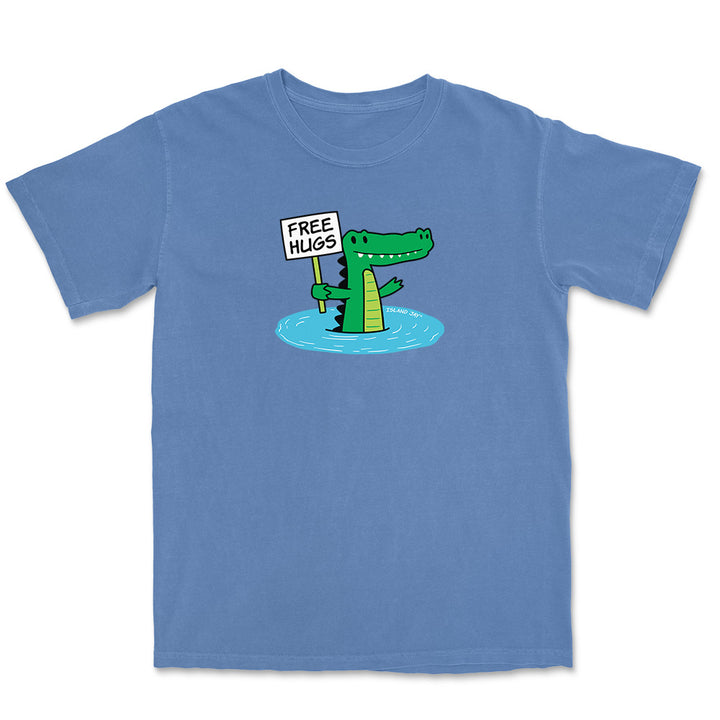 Blue T-shirt with alligator graphic and text reading "free hugs".
