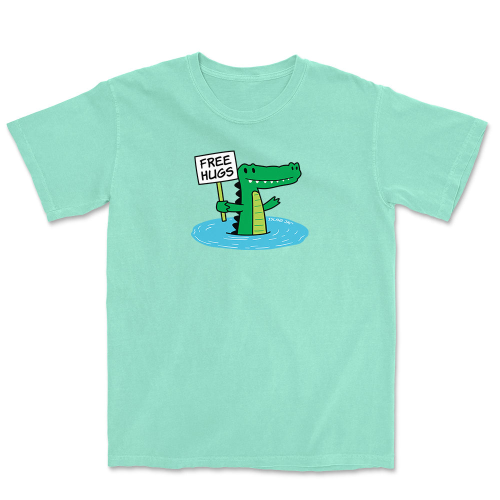 Mint green T-shirt with alligator graphic and text reading "free hugs".